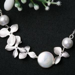 White Coin Pearl and Orchid flowers..